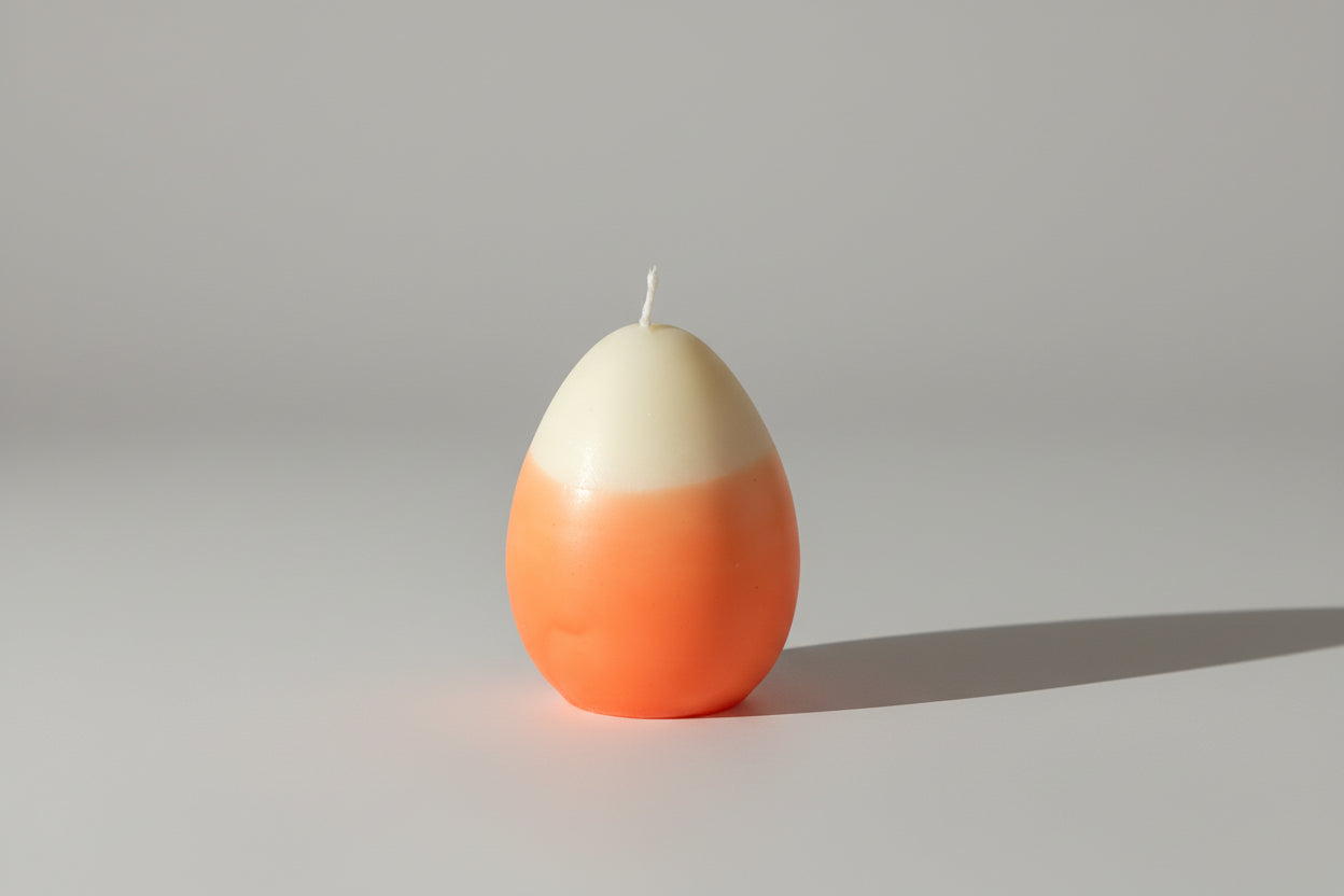 Two-tone orange and white candle 